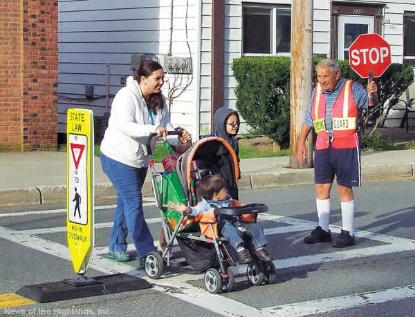 Photo by Jason Kaplan Ted Dobias takes the time to say “hello” to parents and children on the first day of school. Dobias is a crossing guard on Hudson Street in front of Cornwall-on-Hudson Elementary School. 