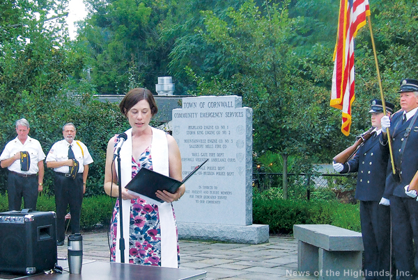 Photo by Ken Cashman Pastor Tricia Calahan of the Cornwall Presbyterian Church reads the invocation at the Patriot Day observance at Chadeayne Circle.