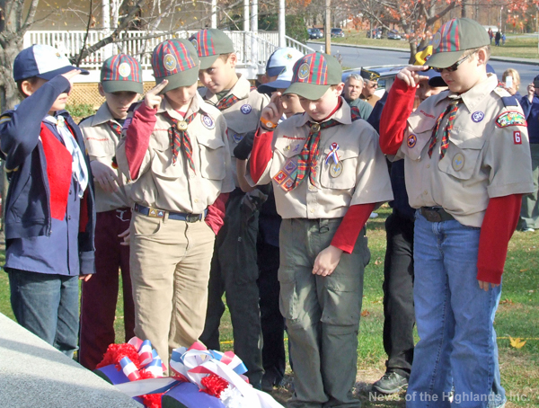 The Pack 6 Webelos saluted after placing wreath at the monument.