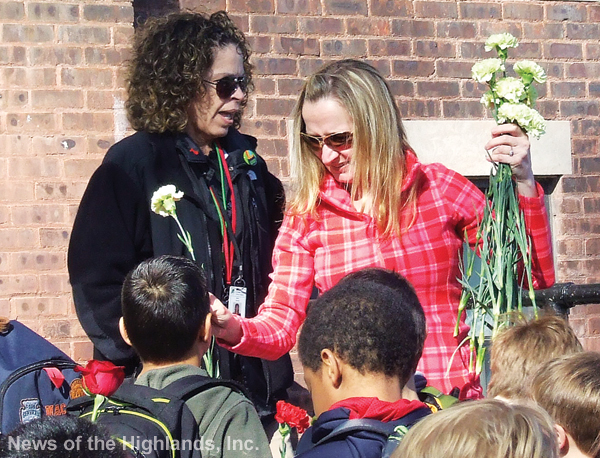 Photo by Ken Cashman Before school started, Willow Avenue PTO members distributed flowers for students to give to their teachers on Teacher Appreciation Day. Holding a bouquet is Brenda Guttenberg. Behind her is Mindy Currao.