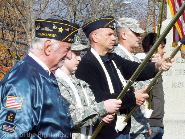 Photo by Ken Cashman The members of the Veterans Day color guard varied in age. From left to right are Ed Flynn, Michael Kane, Tom Haughey, Vinnie Mannion and Nelson Oliveras.