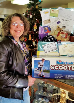 Maryanne O’Dell with the prizes she won in the Nov. 29 Shop Hop 