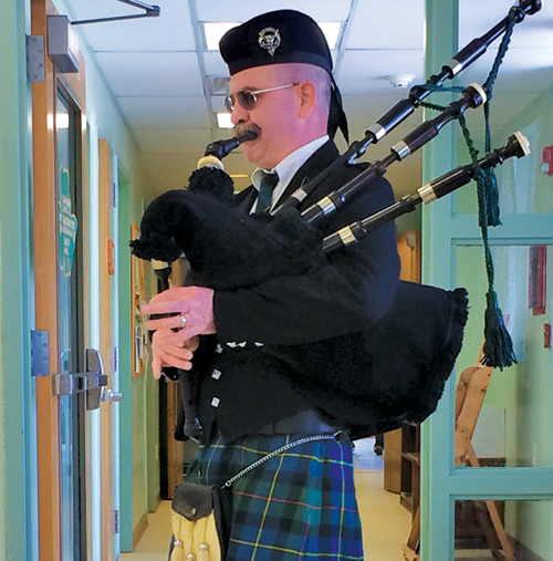 Photo contributed In anticipation of St. Patrick’s Day, Ed Capper of the Clan MacLeod, played the bagpipes for seniors at Munger Cottage on March 13. 
