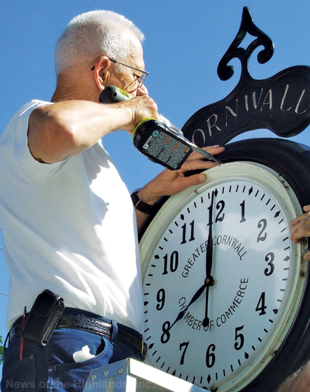 Photo by Jason Kaplan Aubrey Kinney, of Back in “Time” Antique & Modern Clock Repair, fixed and reinstalled the clock which stands in front of the municipal lot in the Town of Cornwall.