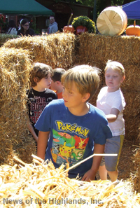 Photo by Jason Kaplan Kids enjoyed running through the hay maze.