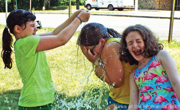 Photo by Jason Kaplan In an effort to escape from the summer heat last week, the Town of Cornwall camp held a water balloon toss. The campers used the remaining balloons to cool off or throw at each other. Beah Coutant bursts a balloon over the head of Evyn Lovell while Emma Halvorsen tries to catch a few of the drops.