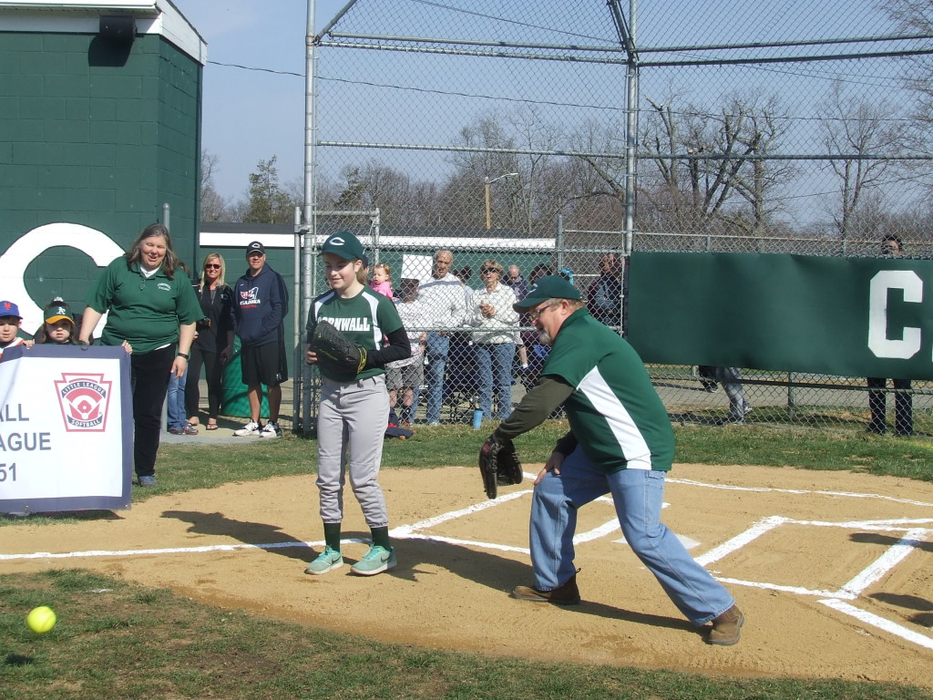 WILD PITCH. The softball is thrown to the right of Steve Accilli. His daughter, Hannah, later caught the baseball.