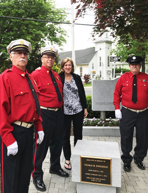 Contributed photo Steve Johnson, Jim Bryan, Anne Ringlehan Potter and Jim Pacenza surround the new Ringlehan monument after the June 2 ceremony at the Storm King Engine Fire House. 