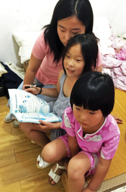 File photo The Chen sisters in their home in China. The girls lived on their own for two years until they arrived in the United States on July 22.