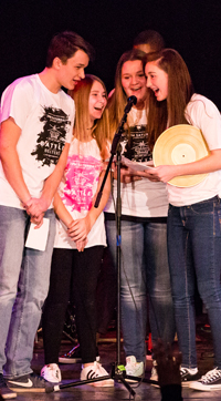 Pierce Pramuka, Ainhoa Divar, Sophia Grausso and Rory Tobin step up to the microphone at the Battle of the Belters, the first fund-raiser for the Storm King Student Scholarship.